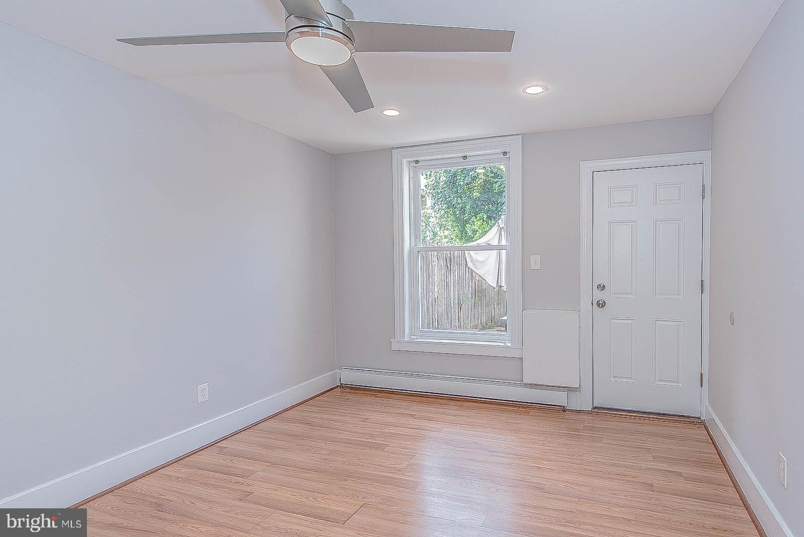 2022 Ogden Street Philadelphia, PA 19130 - Photo 12 of 44 wooden floor in an empty room with a window