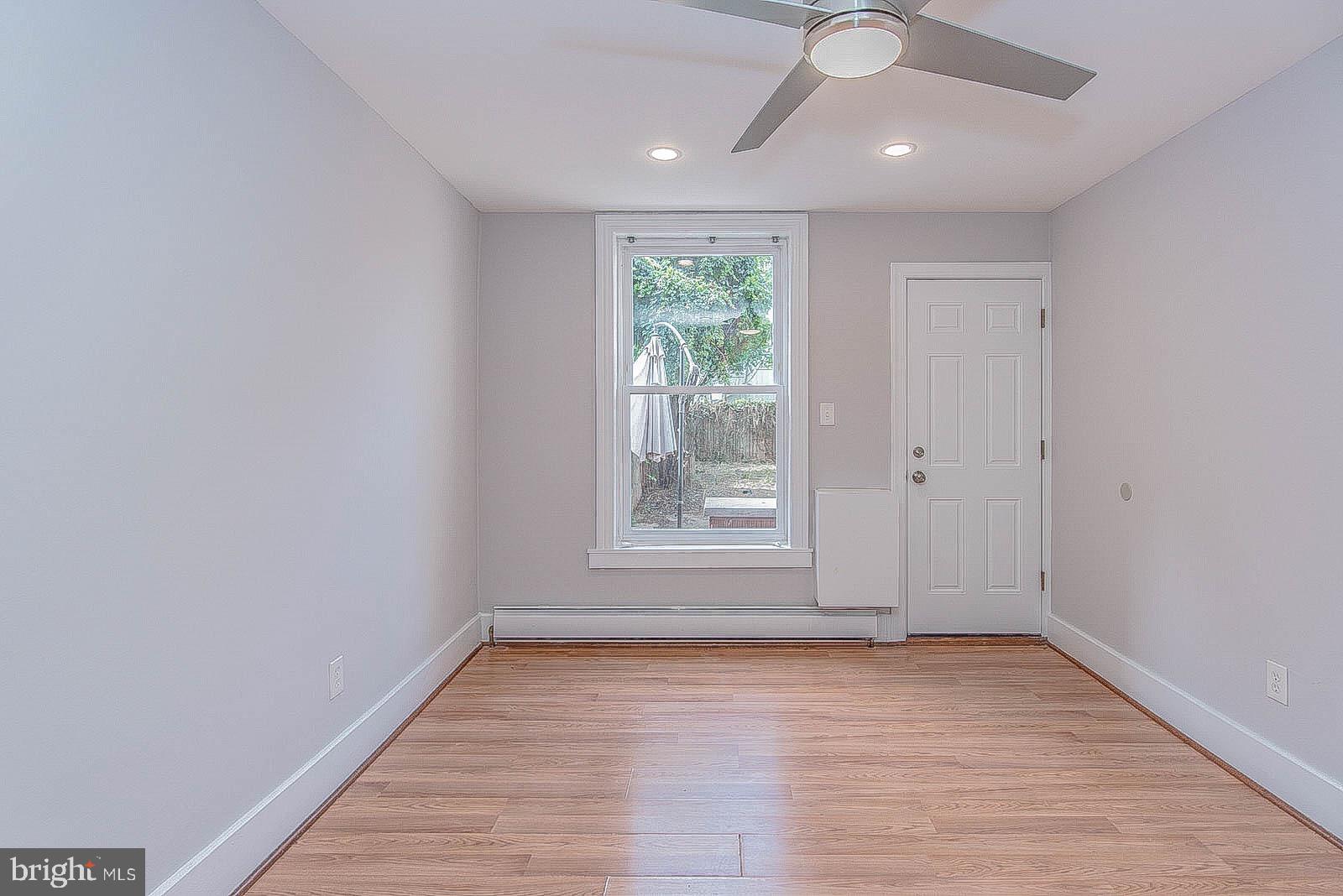 2022 Ogden Street Philadelphia, PA 19130 - Photo 13 of 44 an empty room with wooden floor and windows