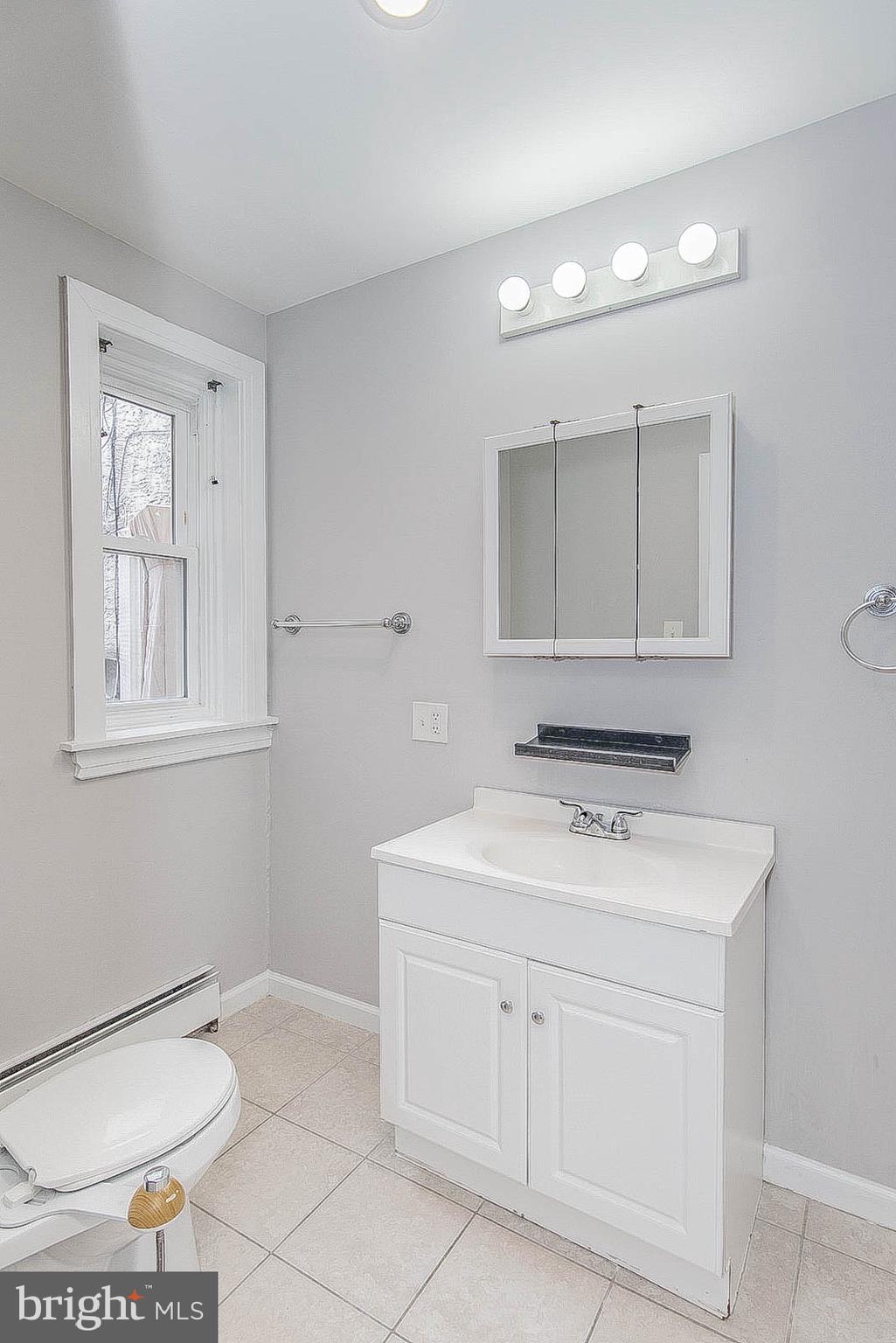 2022 Ogden Street Philadelphia, PA 19130 - Photo 16 of 44 a bathroom with a sink toilet and vanity