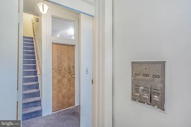 a kitchen with stainless steel appliances granite countertop a refrigerator a stove and a sink