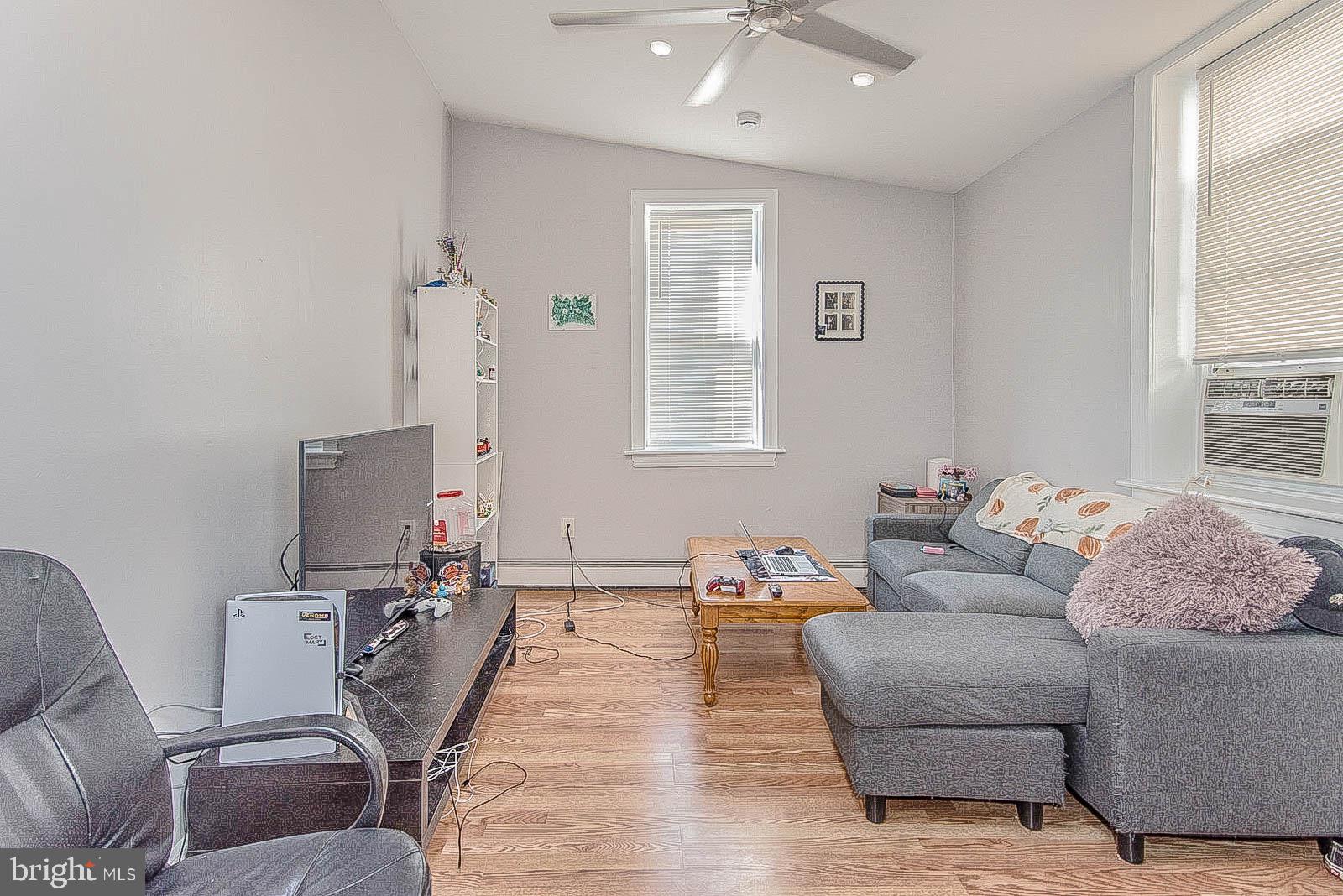 2022 Ogden Street Philadelphia, PA 19130 - Photo 31 of 44 a living room with furniture and wooden floor