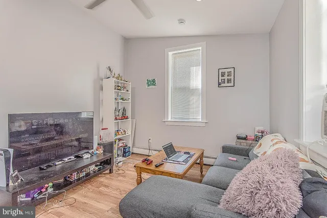 a living room with furniture and a chair