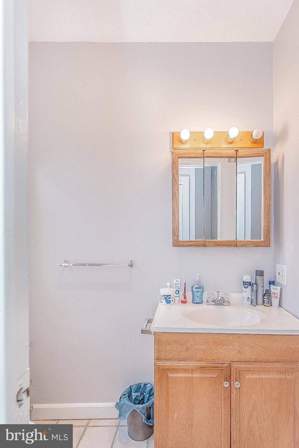 2022 Ogden Street Philadelphia, PA 19130 - Photo 35 of 44 a bathroom with a sink and a mirror