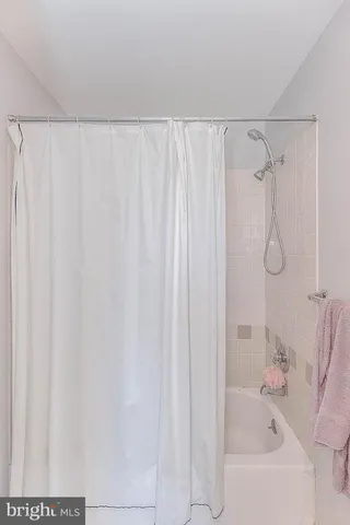 a bedroom with a bed and a table