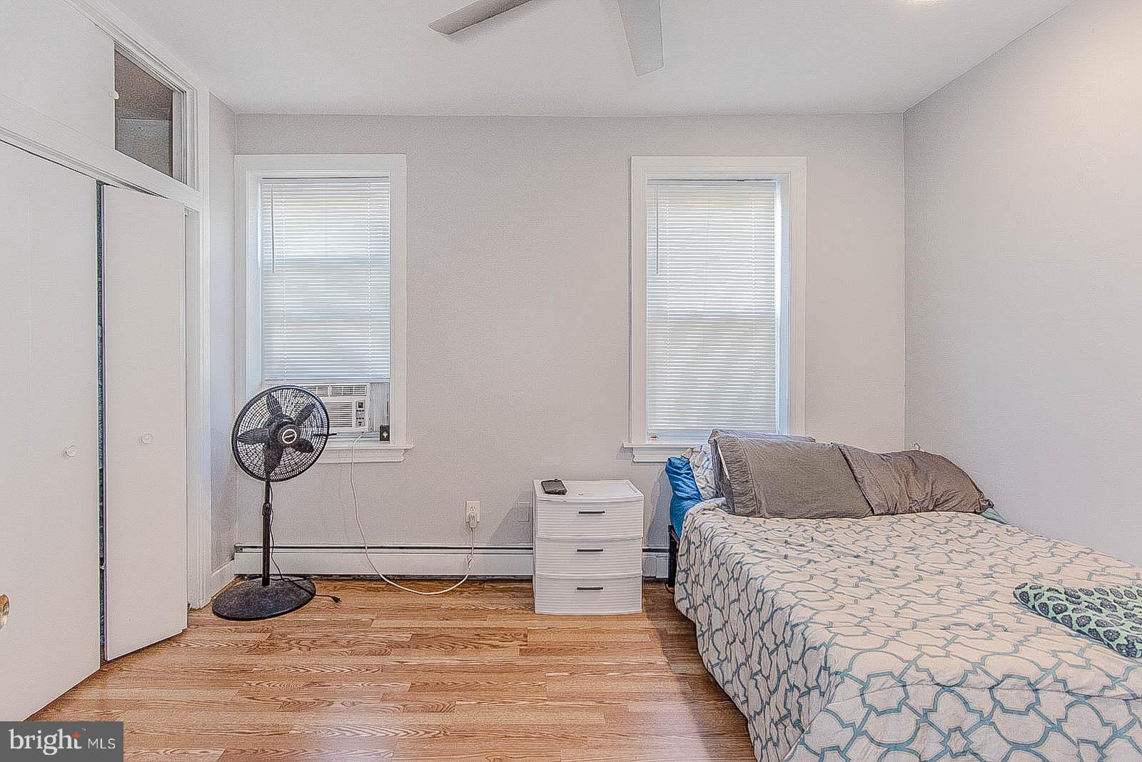 2022 Ogden Street Philadelphia, PA 19130 - Photo 37 of 44 a bedroom with a bed and a table