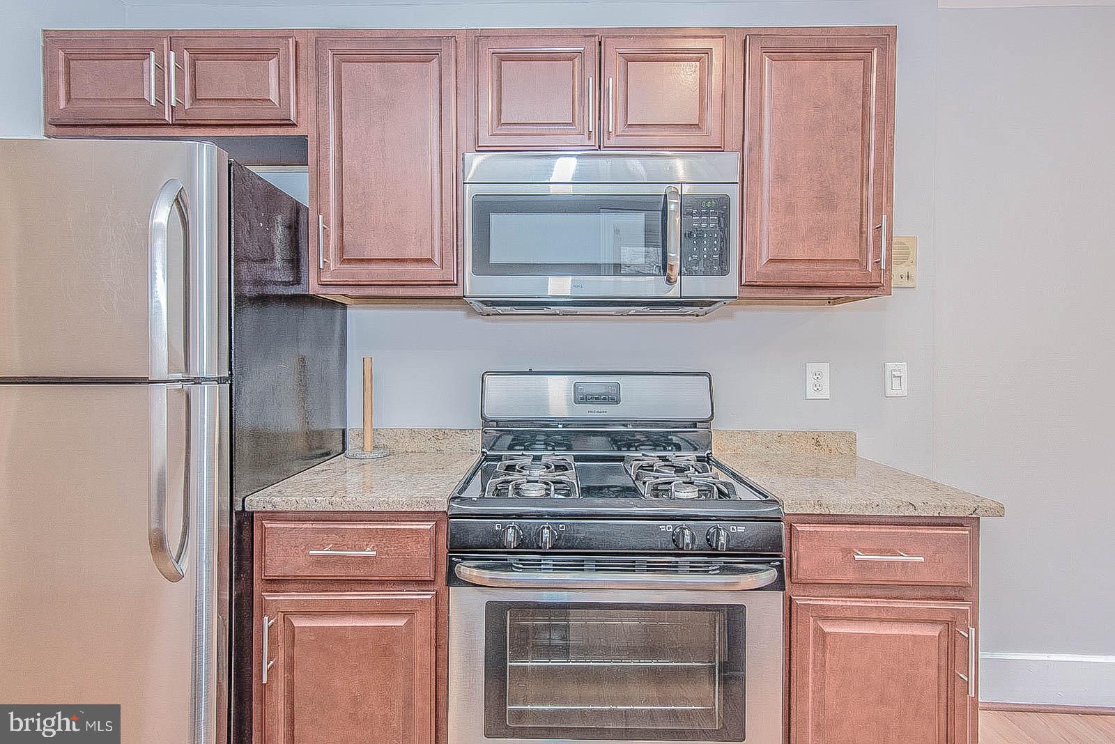 2022 Ogden Street Philadelphia, PA 19130 - Photo 10 of 44 a stove top oven sitting inside of a kitchen