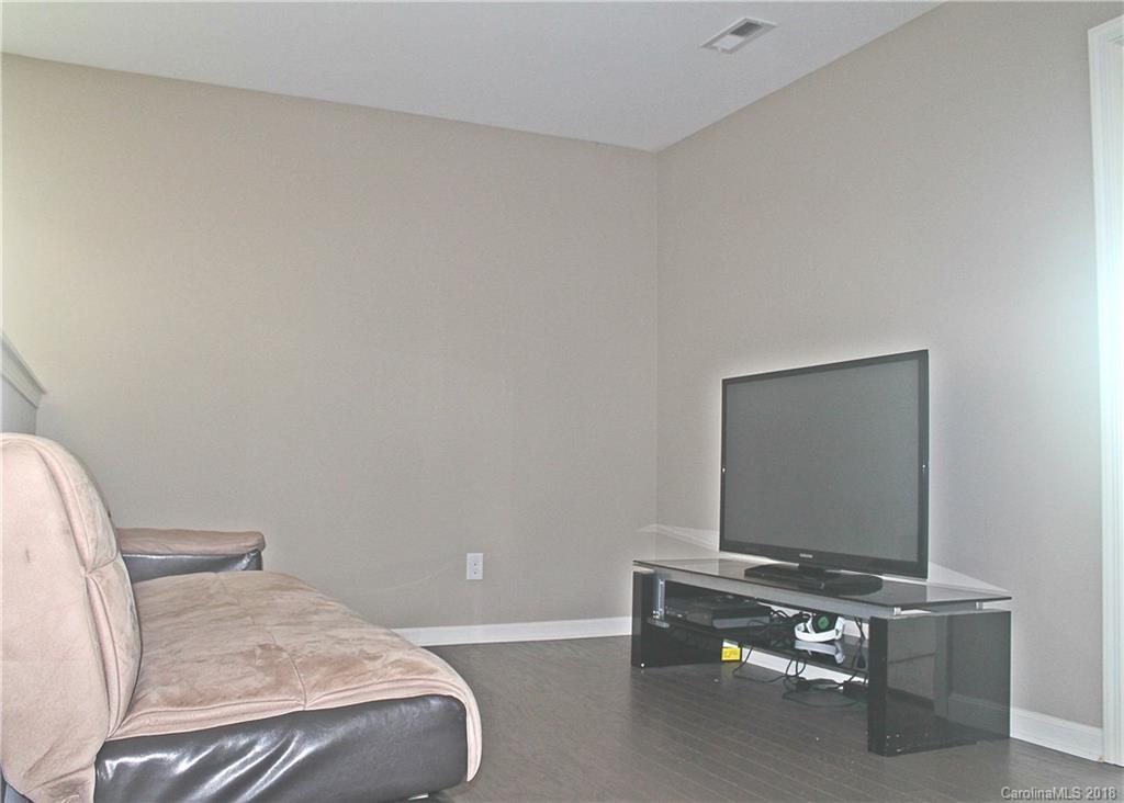 519 Rook Road Charlotte, NC 28216 - Photo 11 of 20 a room with a bed and a flat screen tv