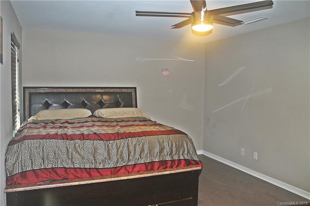 519 Rook Road Charlotte, NC 28216 - Photo 12 of 20 a bedroom with a bed and window