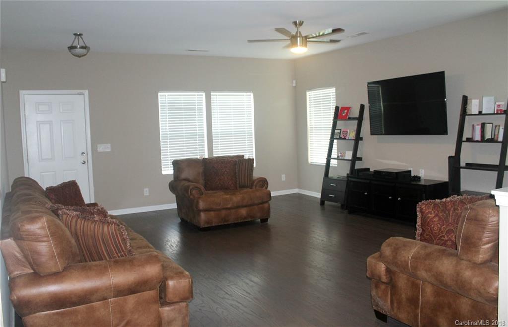 519 Rook Road Charlotte, NC 28216 - Photo 3 of 20 a living room with furniture and a flat screen tv