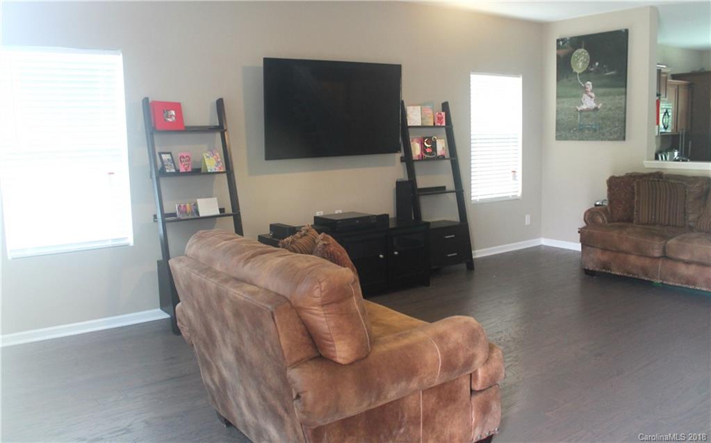 519 Rook Road Charlotte, NC 28216 - Photo 4 of 20 a living room with furniture and a flat screen tv