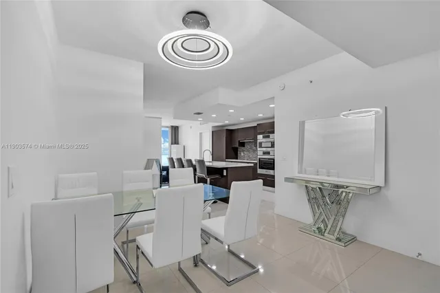 a living room with a table and chairs