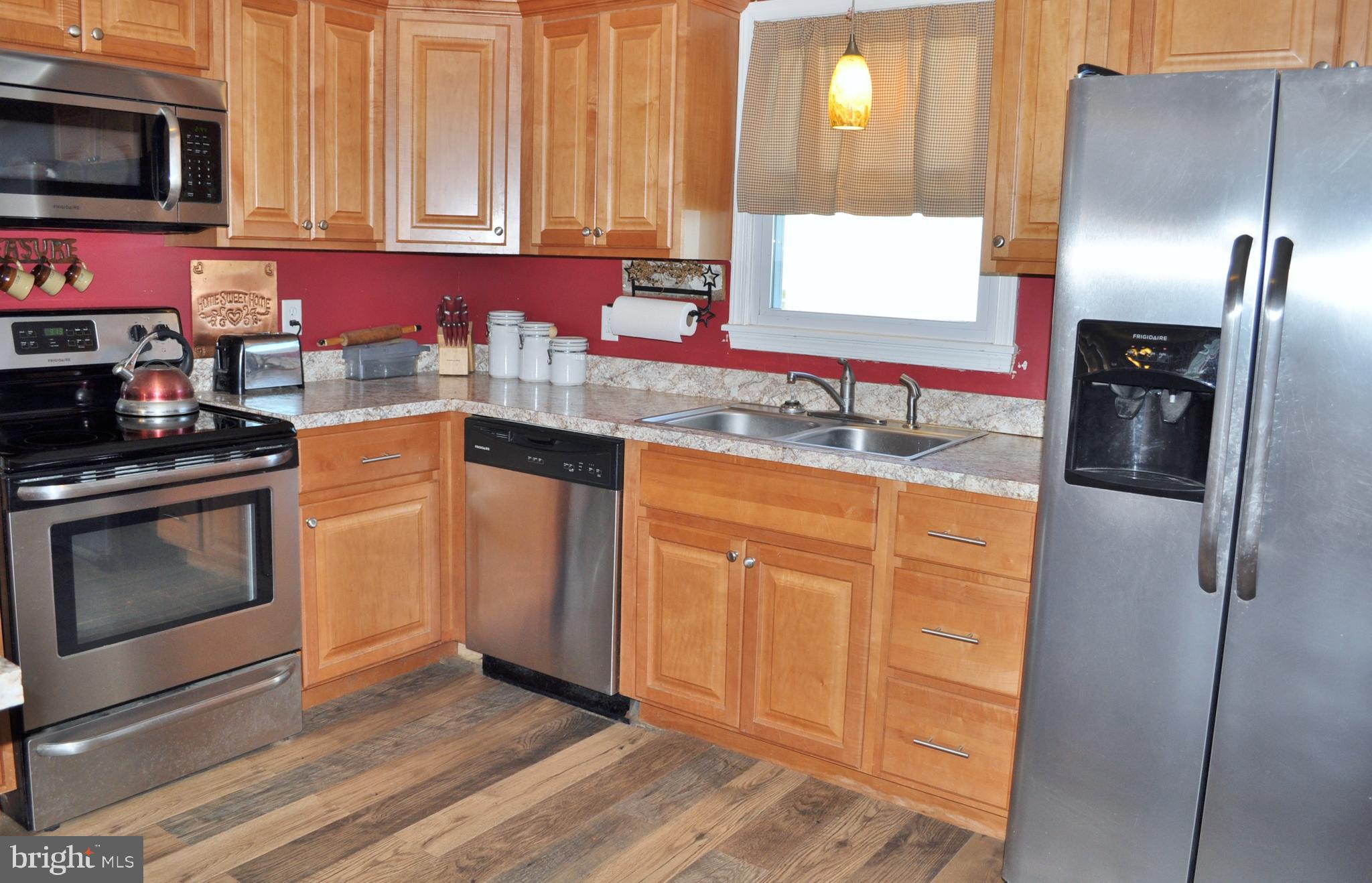 1976 Stoverstown Road Spring Grove, PA 17362 - Photo 11 of 66 a kitchen with stainless steel appliances granite countertop a refrigerator sink and microwave