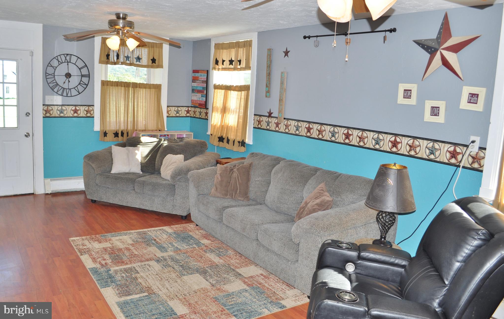 1976 Stoverstown Road Spring Grove, PA 17362 - Photo 16 of 66 a living room with furniture and a chandelier