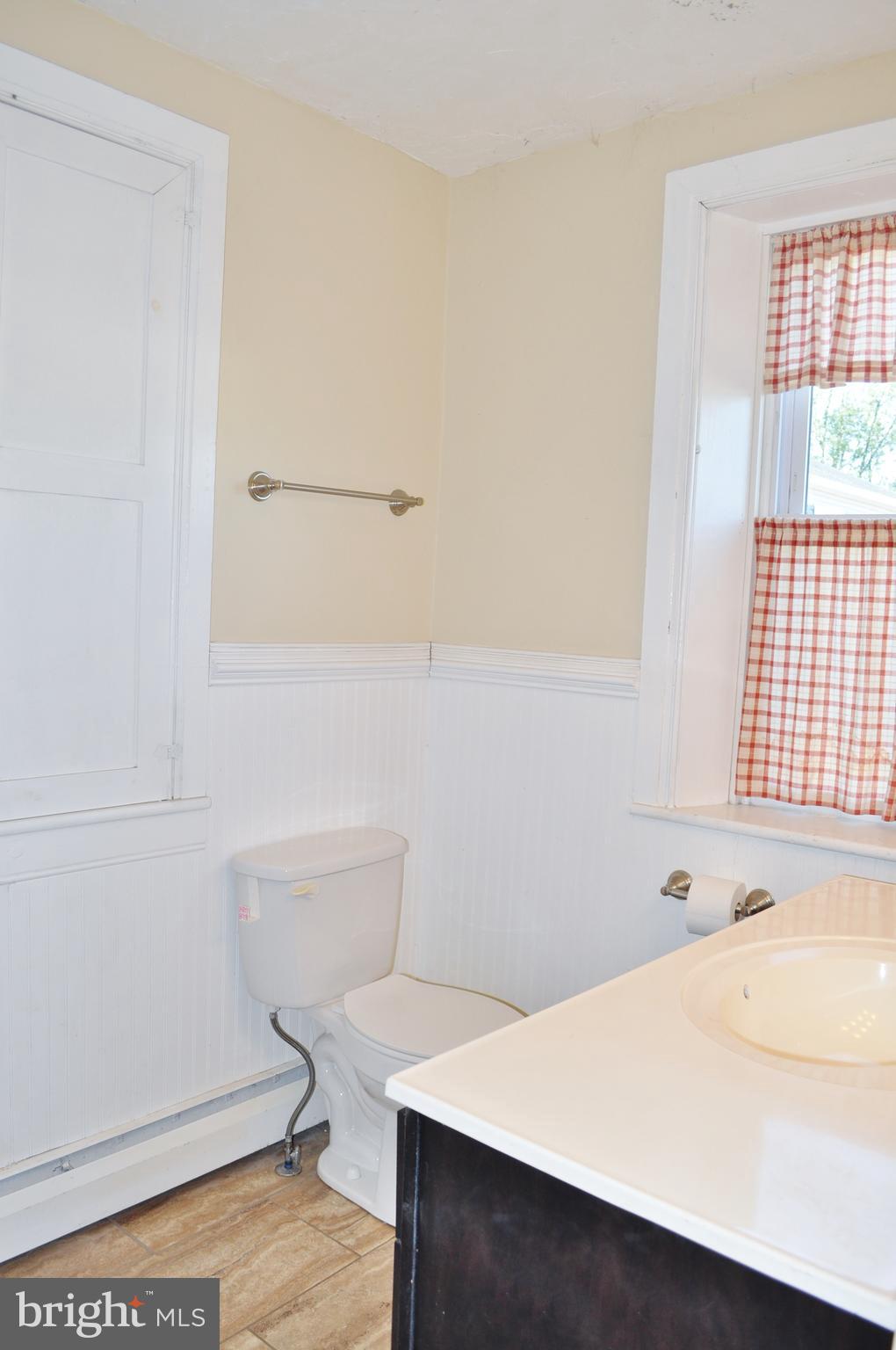 1976 Stoverstown Road Spring Grove, PA 17362 - Photo 33 of 66 a bathroom with a sink a toilet and a window