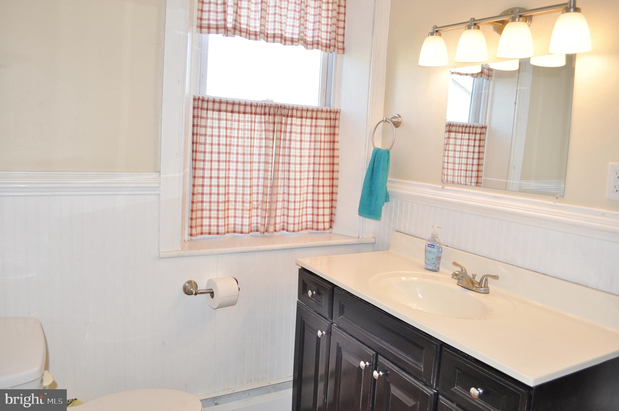 1976 Stoverstown Road Spring Grove, PA 17362 - Photo 34 of 66 a bathroom with a sink vanity granite and a toilet