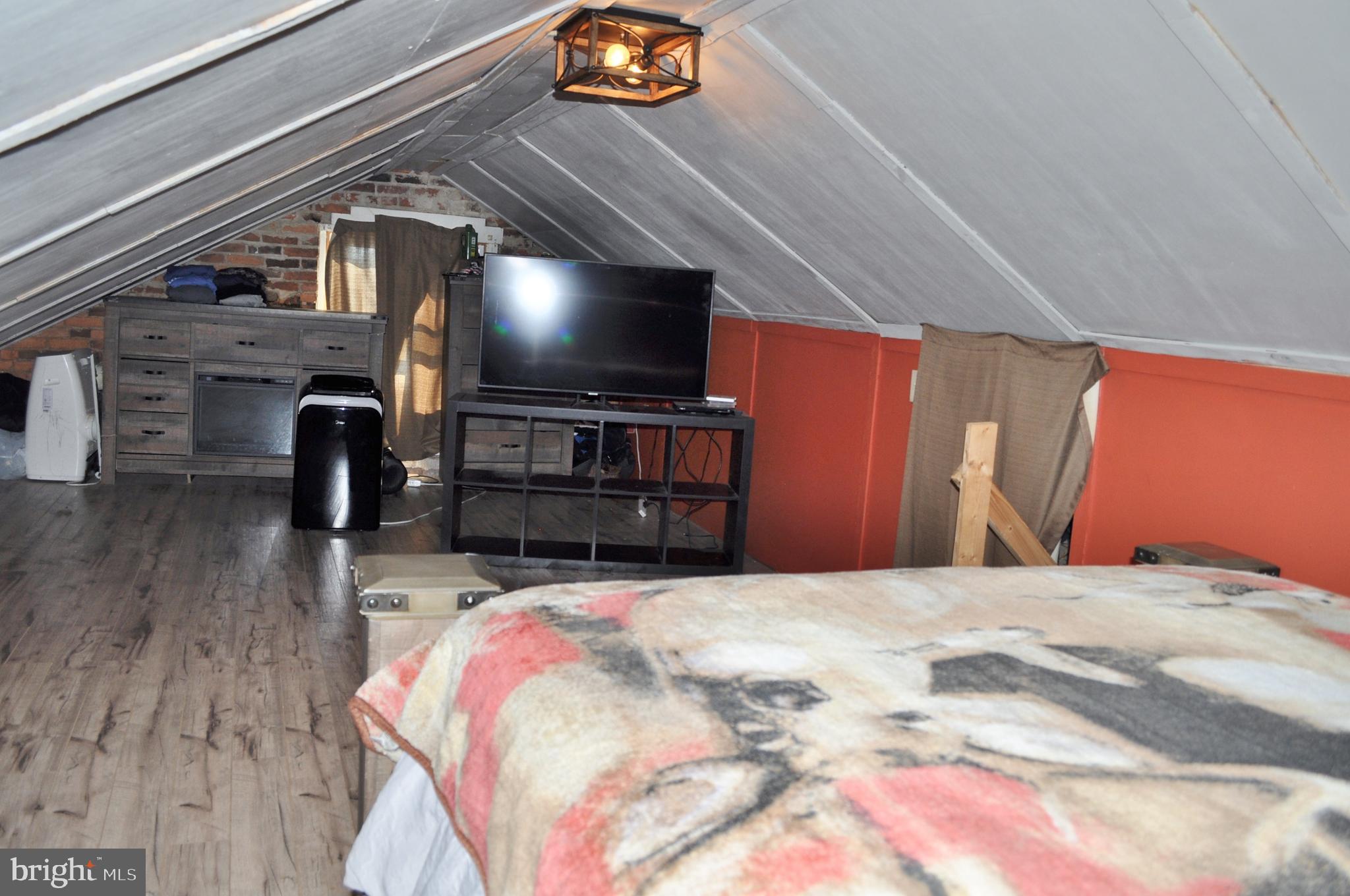 1976 Stoverstown Road Spring Grove, PA 17362 - Photo 51 of 66 a bedroom with a bed and a flat screen tv
