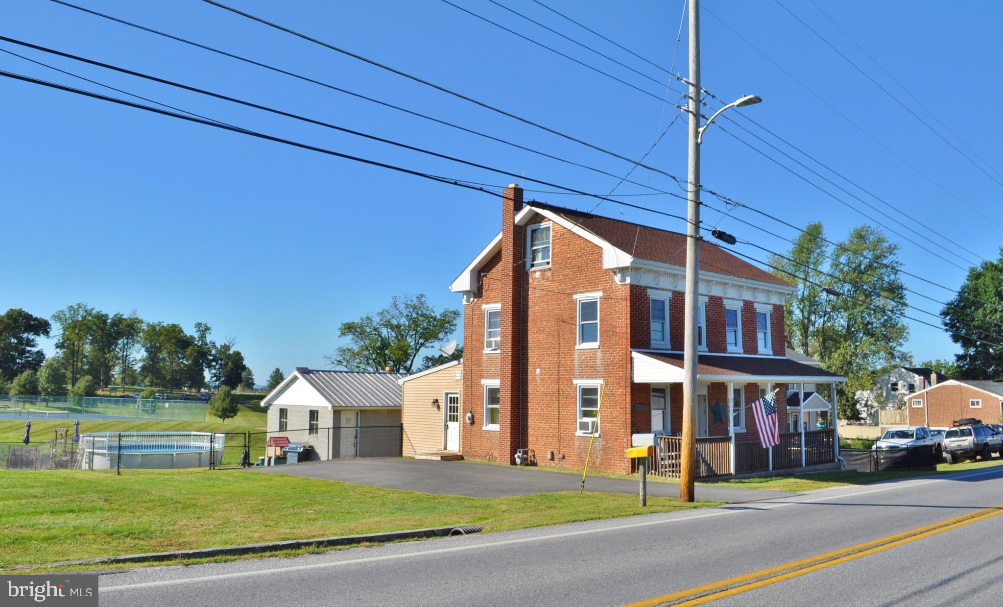 1976 Stoverstown Road Spring Grove, PA 17362 - Photo 64 of 66 a view of a building with a yard
