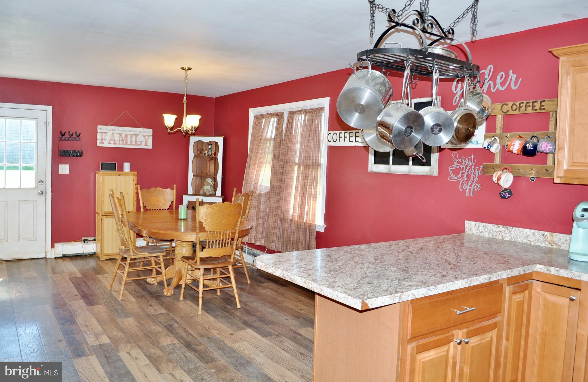 1976 Stoverstown Road Spring Grove, PA 17362 - Photo 7 of 66 a view of a dining room with furniture and chandelier