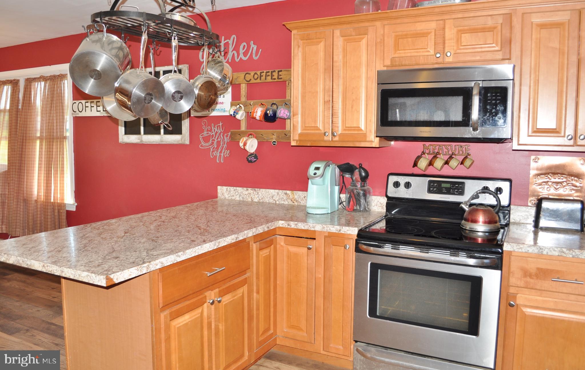 1976 Stoverstown Road Spring Grove, PA 17362 - Photo 8 of 66 a kitchen with stainless steel appliances granite countertop a stove and a microwave
