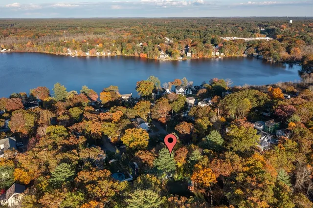 an aerial view of a houses with ocean view