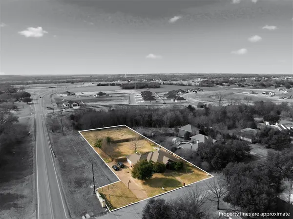 an aerial view of a house with a swimming pool