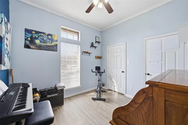 a bedroom with furniture and a window
