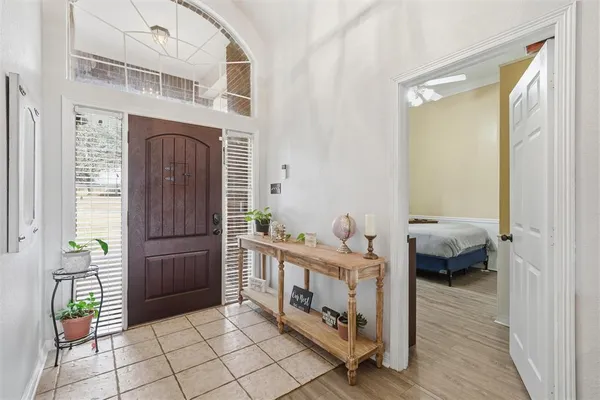 a bedroom with furniture and a window