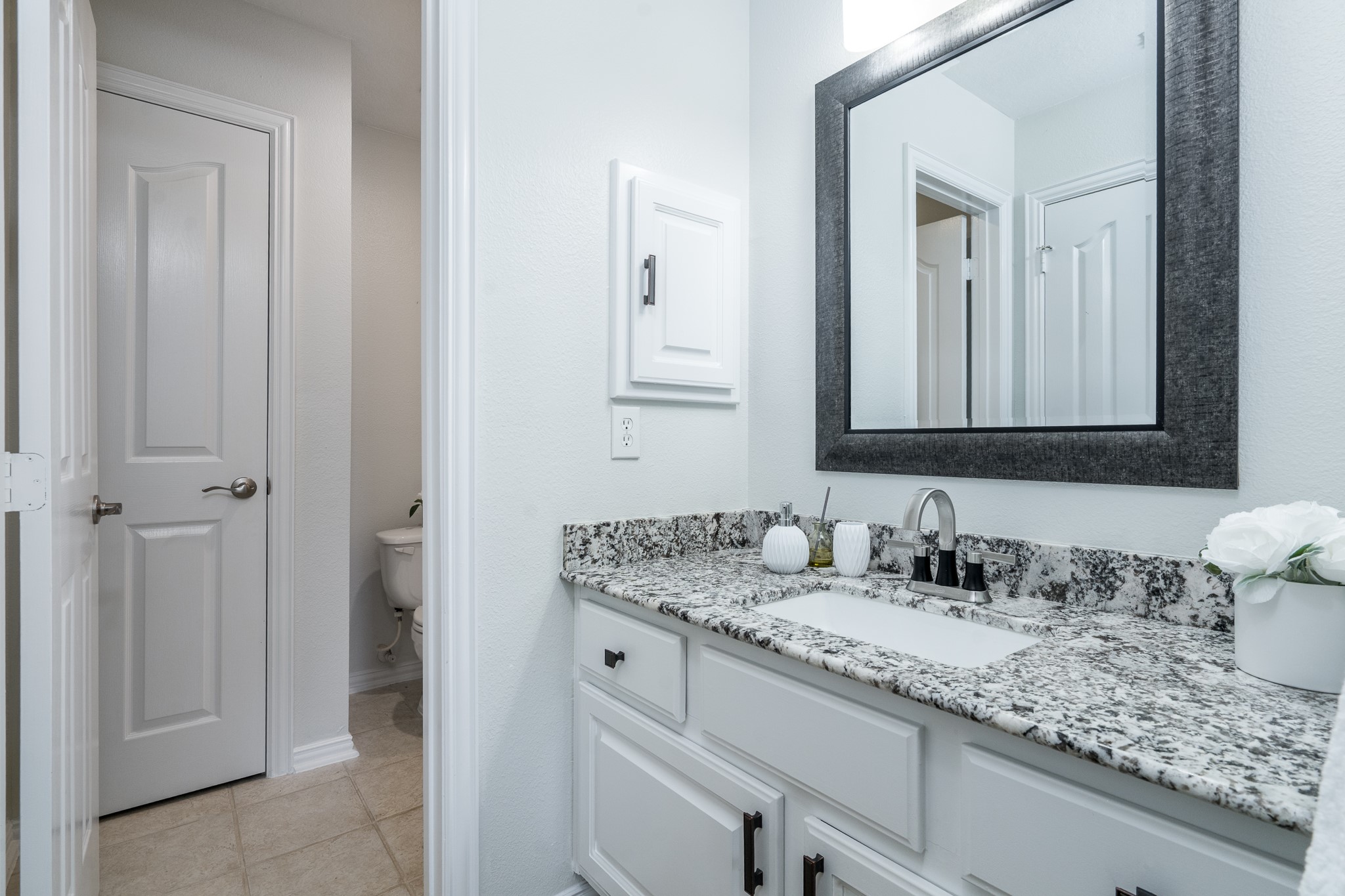 5914 Oakmoss Trail Spring, TX 77379 - Photo 30 of 50 Gorgeous granite countertops adorn this upstairs sink/vanity space with direct access into the 5th bedroom!