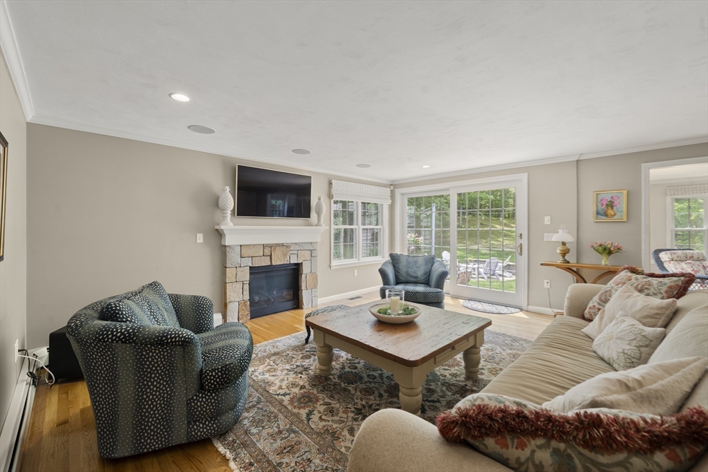 30 Franklin Rodgers Road Hingham, MA 02043 - Photo 13 of 37 a living room with furniture a fireplace and a flat screen tv