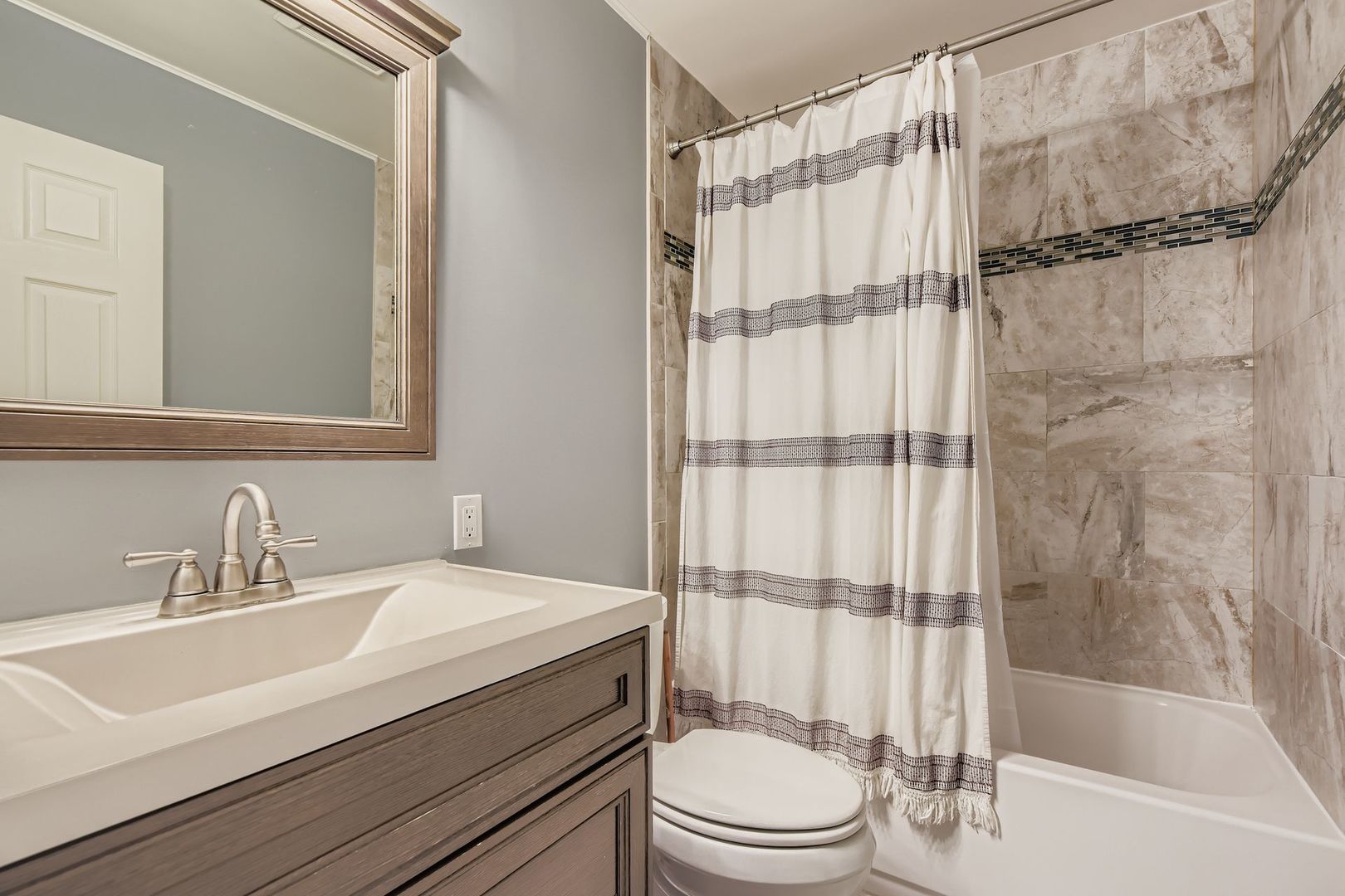 1078 Newport Harbor, Unit 1078 Schaumburg, IL 60193 - Photo 8 of 13 a bathroom with a sink toilet and shower