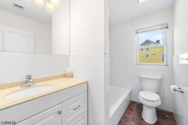 a bathroom with a sink toilet and vanity