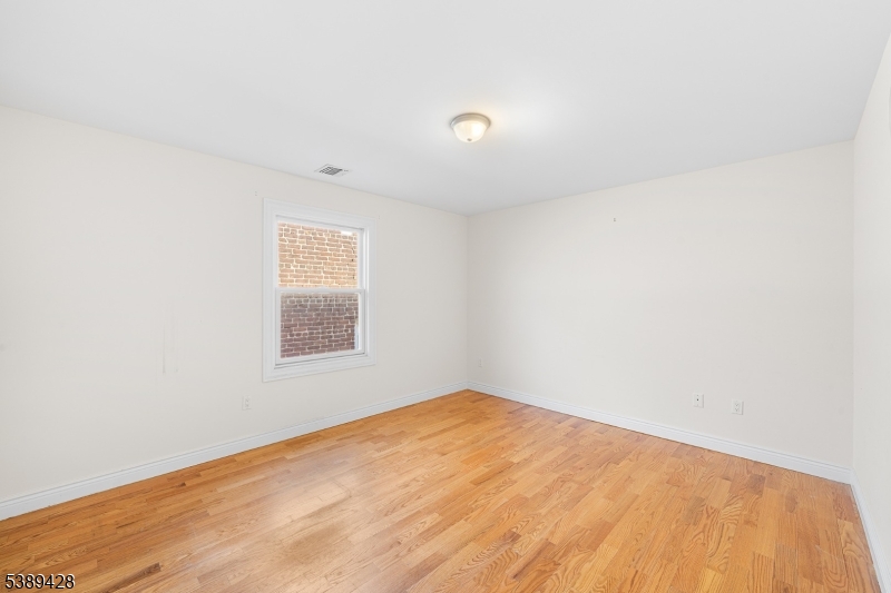 233 5th Street, Unit B Fairview, NJ 07022 - Photo 17 of 31 an empty room with a window