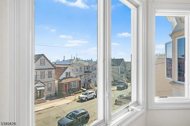 a view of a porch with a floor to ceiling window and an entryway