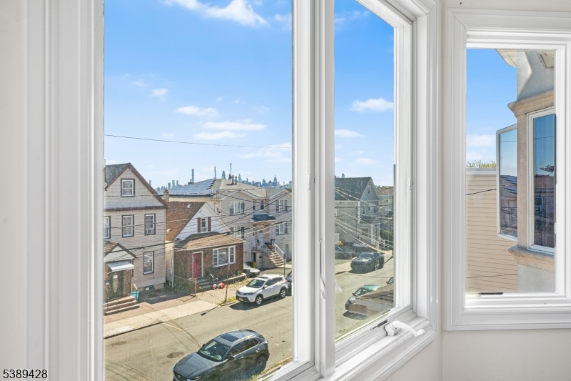 233 5th Street, Unit B Fairview, NJ 07022 - Photo 23 of 31 a view of a porch with a floor to ceiling window and an entryway