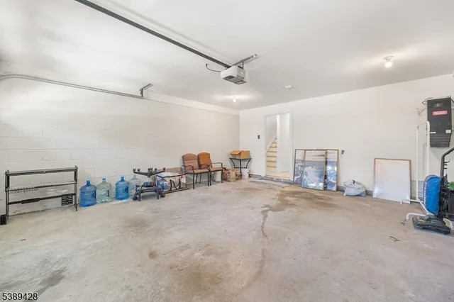 a view of a livingroom with furniture and a ceiling fan