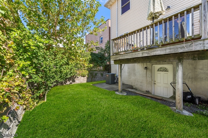 233 5th Street, Unit B Fairview, NJ 07022 - Photo 30 of 31 a view of a house with a wooden deck