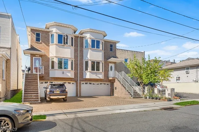a front view of a building with parking space