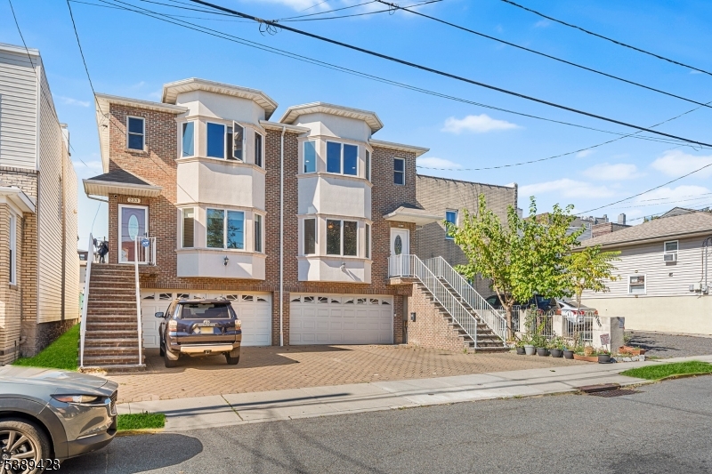 233 5th Street, Unit B Fairview, NJ 07022 - Photo 3 of 31 a front view of a building with parking space