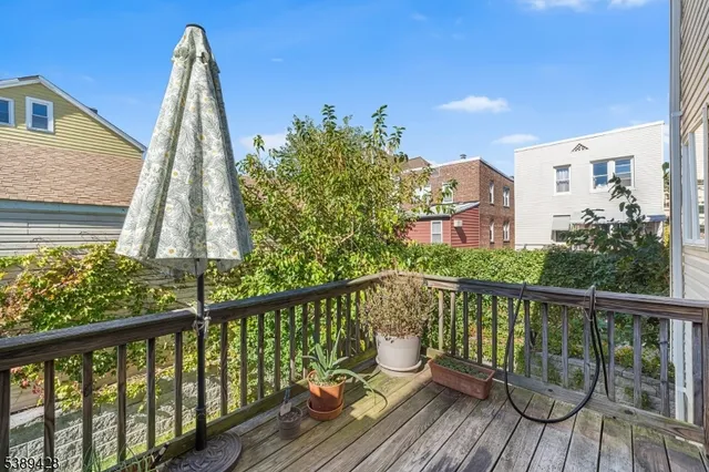 a view of a wooden chairs and a small yard