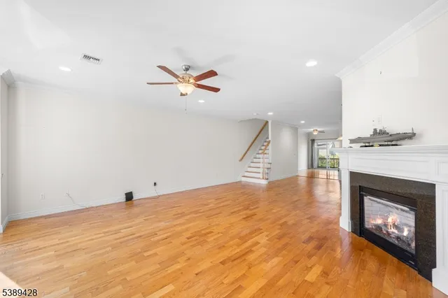 a view of an empty room with a fireplace