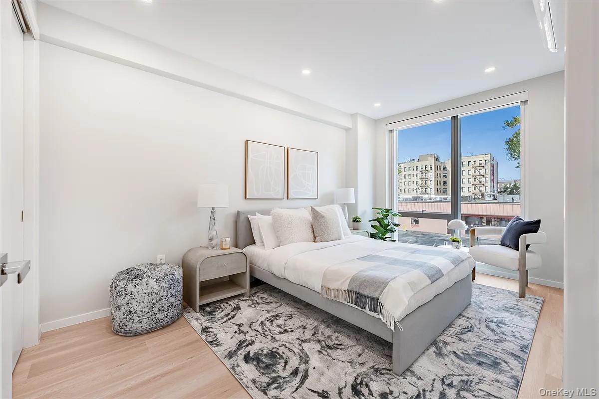 a bedroom with a large bed and a window