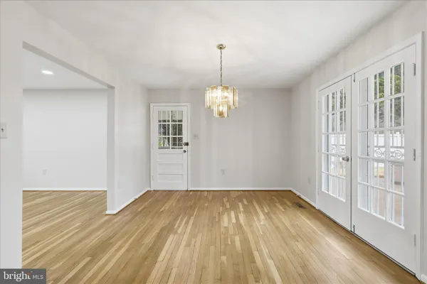 a view of an empty room with a fireplace
