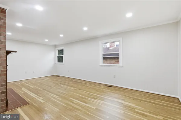a view of kitchen with sink microwave and refrigerator
