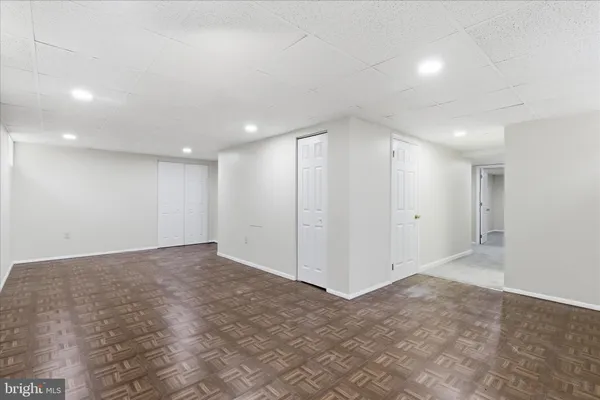 a white toilet sitting next to a bathroom sink