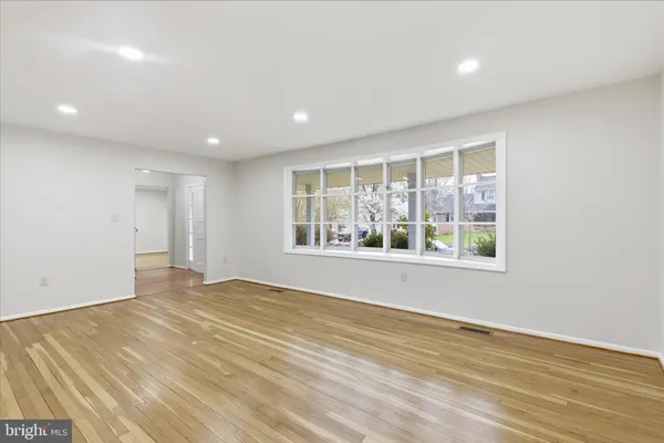 a view of a kitchen with granite countertop a stove top oven