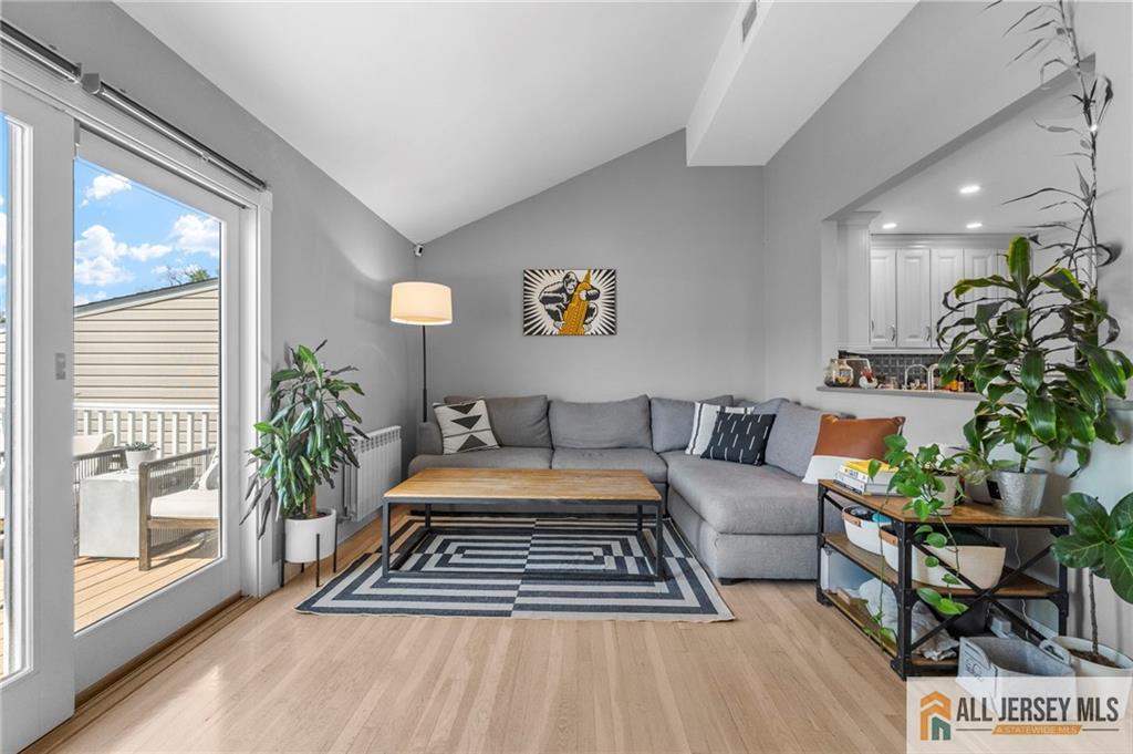 21 Starlight Drive Colonia, NJ 07067 - Photo 17 of 41 a living room with furniture and a potted plant