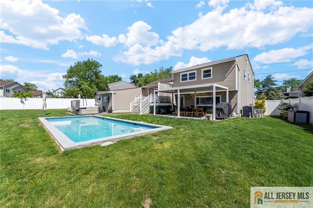 21 Starlight Drive Colonia, NJ 07067 - Photo 30 of 41 a view of an house with swimming pool and yard