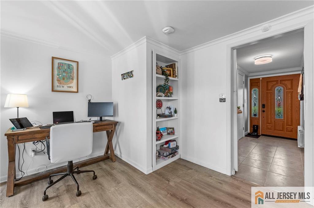 21 Starlight Drive Colonia, NJ 07067 - Photo 6 of 41 a view of a livingroom with furniture and a workspace