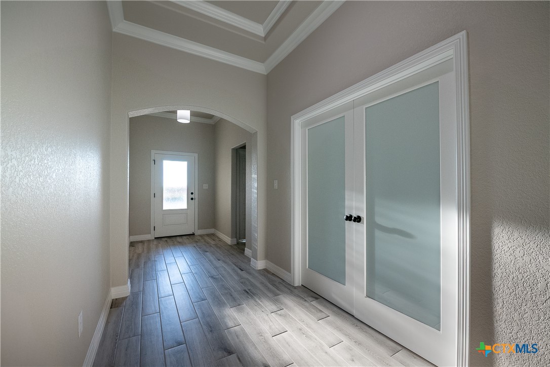 1404 Red Rock Road Hewitt, TX 76643 - Photo 7 of 30 a view of a hallway with wooden floor
