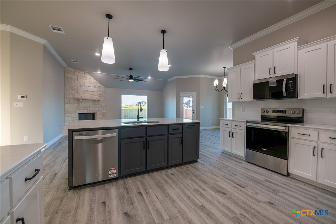 1404 Red Rock Road Hewitt, TX 76643 - Photo 10 of 30 a large kitchen with stainless steel appliances lots of counter top space